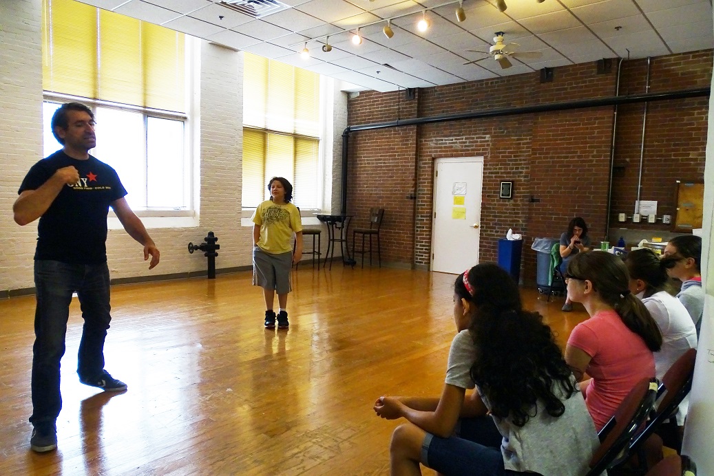 Teaching Artist John Gregorio with the Young Company middle school group